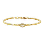 Pulsera en oro amarillo de 18 K con bolitas y diamantes de 26 puntos en total.